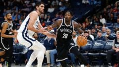 Feb 26, 2024; Memphis, Tennessee, USA; Brooklyn Nets forward Dorian Finney-Smith (28) drives to the basket as Memphis Grizzlies forward-center Santi Aldama (7) defends during the second half at FedExForum. Mandatory Credit: Petre Thomas-USA TODAY Sports