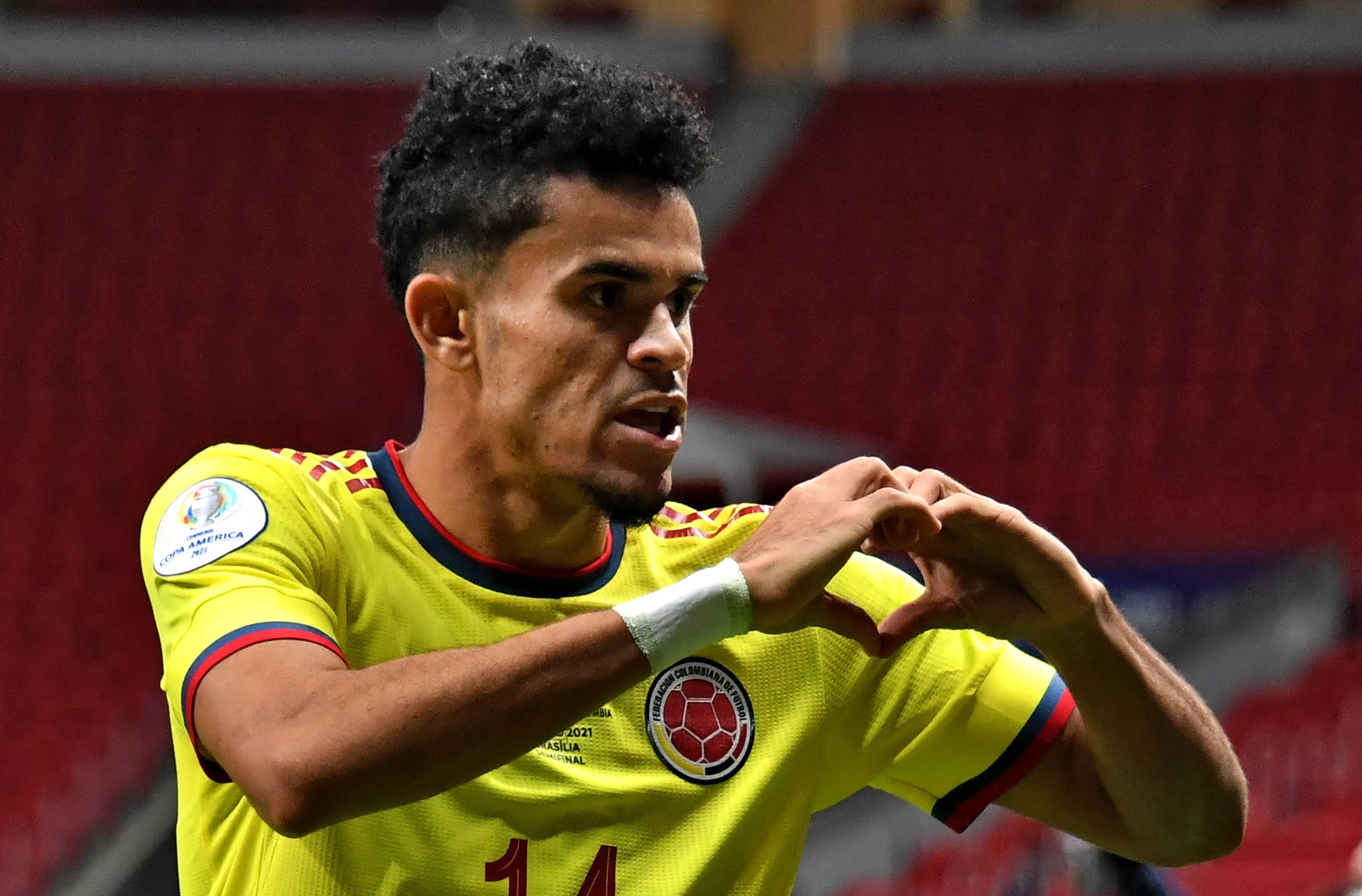 (FILES) Colombia's Luis Diaz celebrates after scoring against Argentina during their Conmebol 2021 Copa America football tournament semi-final match at the Mane Garrincha Stadium in Brasilia, Brazil, on July 6, 2021. The South American inexhaustible youth craddle is starting to replace its pool of players, many of which have just won the Champions League, the Premier League or are competing at the highest level. The list includes Vinicius Jr, Rodrygo, Juli�n �lvarez, Mac Allister, Luis D�az, and Federico Valverde, among others. (Photo by NELSON ALMEIDA / AFP)