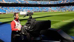 A tv cameraman operates a camera prior to   the La Liga match between Real Madrid and Eibar at Estadio Santiago Bernabeu on April 11, 2015 in Madrid, Spain. 