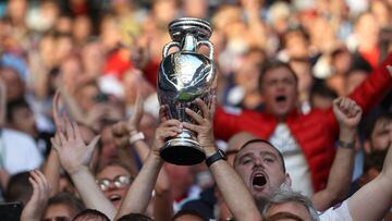 Soccer Football - Euro 2020 - Semi Final - England v Denmark - Wembley Stadium, London, Britain - July 7, 2021 England fans in the stands hold up a replica trophy before the match Pool via REUTERS/Carl Recine
