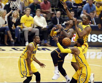 Cleveland Cavaliers forward LeBron James (23) gets fouled going up for a shot against Indiana Pacers forwards Thaddeus Young