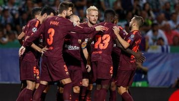 Soccer Football - Champions League - Sporting CP vs FC Barcelona - Estadio Jose Alvalade, Lisbon, Portugal - September 27, 2017  Barcelona&rsquo;s Andres Iniesta, Gerard Pique and teammates celebrate their first goal scored by Sporting&rsquo;s Sebastian C