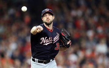 Max Scherzer #31 of the Washington Nationals attempts a pickoff to first base against the Houston Astros during the third inning in Game Seven of the 2019 World Series at Minute Maid Park on October 30, 2019