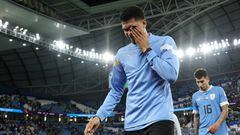 AL WAKRAH, QATAR - DECEMBER 02: Ronald Araujo of Uruguay shows dejection after the team fails to qualify for the knockout stage despite their 2-0 victory after the FIFA World Cup Qatar 2022 Group H match between Ghana and Uruguay at Al Janoub Stadium on December 02, 2022 in Al Wakrah, Qatar. (Photo by Maja Hitij - FIFA/FIFA via Getty Images)