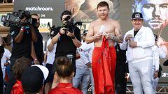 LAS VEGAS, NEVADA - SEPTEMBER 16: Canelo Alvarez of Mexico (L) reacts toward seeing his son, Sa�l Adiel �lvarez, and daughter, Mar�a Fernanda �lvarez, during a ceremonial weigh-in at Toshiba Plaza on September 16, 2022 in Las Vegas, Nevada. Alvarez will meet Gennadiy Golovkin (not pictured) for the undisputed super middleweight title bout at T-Mobile Arena in Las Vegas on September 17.   Sarah Stier/Getty Images/AFP