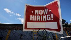 FILE PHOTO: A "now hiring" sign is displayed outside Taylor Party and Equipment Rentals in Somerville, Massachusetts, U.S., September 1, 2022. REUTERS/Brian Snyder/File Photo