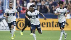 Vancouver Whitecaps&#039; Yordy Reyna, center, Russell Teibert, left, and Inbeom Hwang celebrate Reyna&#039;s goal against D.C. United during the first half of an MLS soccer match Saturday, Aug. 17, 2019, in Vancouver, British Columbia. (Darryl Dyck/The C