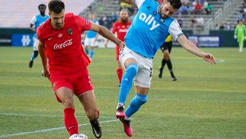 May 24, 2023; Birmingham, AL, USA; Birmingham Legion FC defender Alex Crognale (21) and Charlotte FC midfielder Brandt Bronico (13) go for the ball during the first half at Protective Stadium. Mandatory Credit: Marvin Gentry-USA TODAY Sports