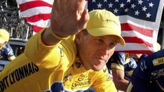 U.S. Postal Service Team rider Lance Armstrong of the United States, the first six-time winner of the Tour de France cycling classic, waves as he cycles past a U.S. flag during the rider&#039;s parade on the Champs-Elysees after the 20th and final stage o