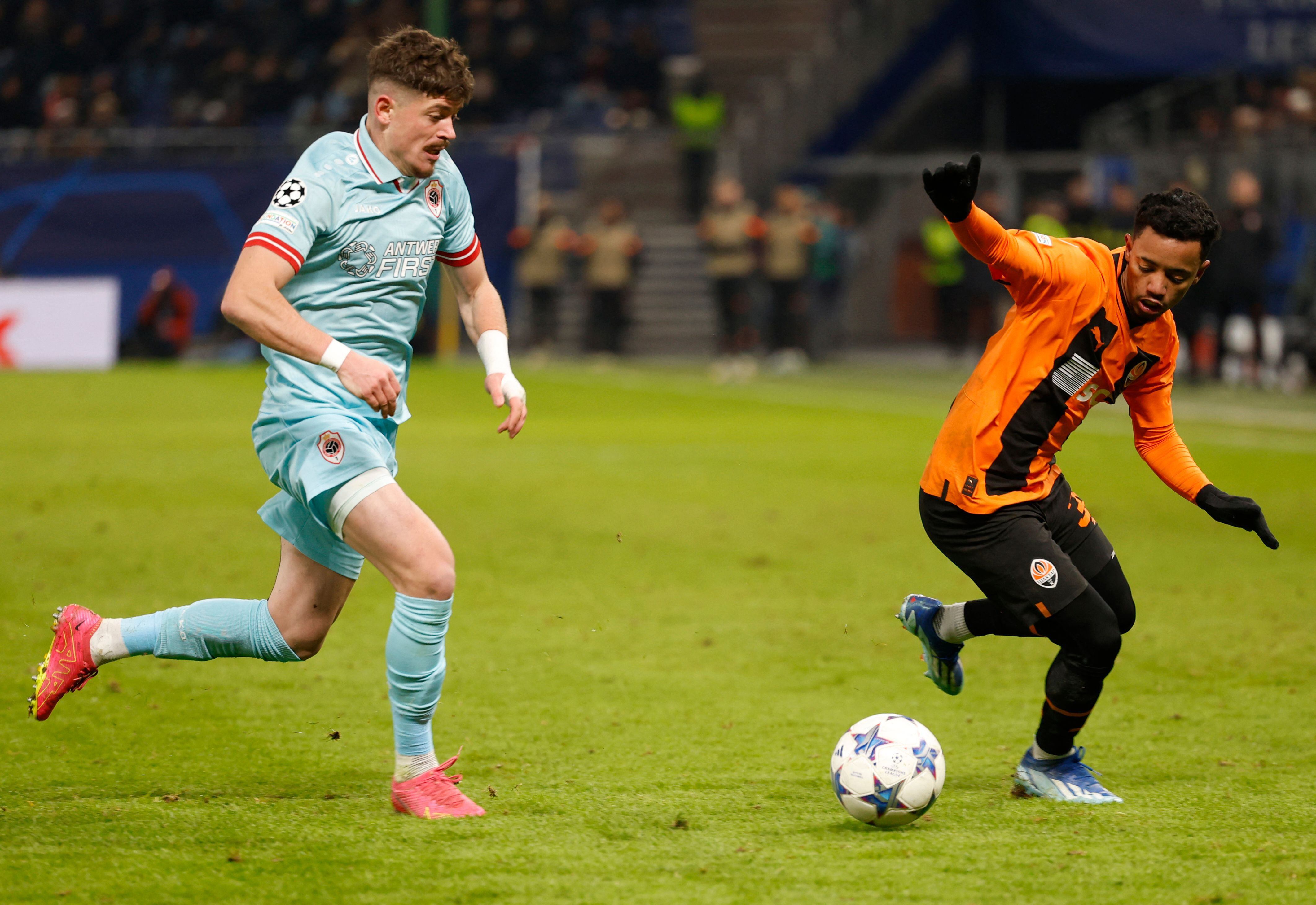 Antwerp's Albanian forward #11 Arbnor Muja and Shakhtar Donetsk's Brazilian forward #39 Newerton vie for the ball during the UEFA Champions League Group H football match between Shaktar Donetsk and Antwerp in Hamburg, on November 28, 2023. (Photo by Axel Heimken / AFP)