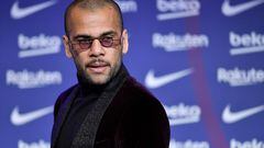 (FILES) New FC Barcelona's Brazilian defender Dani Alves, looks on during his presentation ceremony at the Camp Nou stadium in Barcelona on November 17, 2021. A Spanish court on February 22, 2024 sentenced former Brazil international Dani Alves to four and a half years in prison after finding him guilty of raping a young woman at a Barcelona nightclub in December 2022. (Photo by Pau BARRENA / AFP)