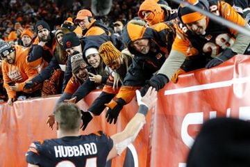 Cincinnati Bengals defensive end Sam Hubbard celebrates with fans following his team's win over the Las Vegas Raiders in the AFC wild card round.