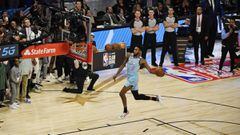 Feb 15, 2020; Chicago, Illinois, USA; Miami Heat player Derrick Jones, Jr. dunks from the free throw line in the slam dunk contest during NBA All Star Saturday Night at United Center. Mandatory Credit: Quinn Harris-USA TODAY Sports