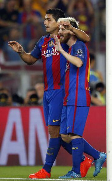 Barcelona's Luis Suarez, left, celebrates with his teammate Lionel Messi after scoring his side's seventh goal during a Champions League, Group C soccer match between Barcelona and Celtic, at the Camp Nou stadium in Barcelona, Spain, Tuesday, Sept. 13, 20