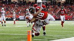 ATLANTA, GA - NOVEMBER 27: Taylor Gabriel #18 of the Atlanta Falcons dives for the pylon past Tony Jefferson #22 of the Arizona Cardinals to score a touchdown during the second half at the Georgia Dome on November 27, 2016 in Atlanta, Georgia.   Kevin C. Cox/Getty Images/AFP == FOR NEWSPAPERS, INTERNET, TELCOS &amp; TELEVISION USE ONLY ==