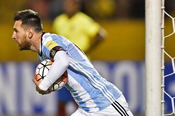 Argentina's Lionel Messi runs with the ball after scoring against Ecuador during their 2018 World Cup qualifier football match in Quito, on October 10, 2017.