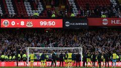 Newcastle players celebrate in front of their fans after the English Premier League football match between Sheffield United and Newcastle United at Bramall Lane in Sheffield, northern England on September 24, 2023. Newcastle won the game 8-0. (Photo by Darren Staples / AFP) / RESTRICTED TO EDITORIAL USE. No use with unauthorized audio, video, data, fixture lists, club/league logos or 'live' services. Online in-match use limited to 120 images. An additional 40 images may be used in extra time. No video emulation. Social media in-match use limited to 120 images. An additional 40 images may be used in extra time. No use in betting publications, games or single club/league/player publications. / 