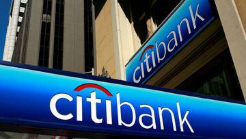 FILE PHOTO: People walk beneath a Citibank branch logo in the financial district of San Francisco, California July 17, 2009. REUTERS/Robert Galbraith/File Photo
