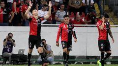 Julio Furch (L) of Atlas celebrates his goal against Tigres with teammates during their Mexican Clausura tournament football match, at the Jalisco stadium, in Guadalajara, Jalisco State, Mexico, on May 18, 2022. (Photo by Ulises Ruiz / AFP)