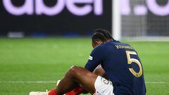 France's defender Jules Kounde sits on the pitch after injury during the UEFA Nations League, League A Group 1 football match between France and Austria at Stade de France in Saint-Denis, north of Paris, on September 22, 2022. (Photo by FRANCK FIFE / AFP)