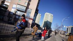 HANDOUT - 26 February 2022, Ukraine, Kiev: A picture provided by the Ukrainian State Emergency Service shows people are being evacuated near a multi-storey residential building in Kiev that was hit by a rocket during the Russian invasion of Ukraine. Photo
