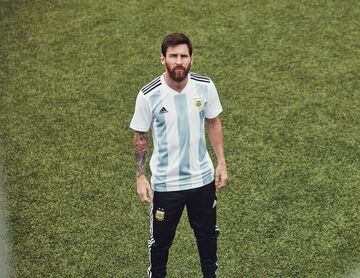 Lionel Messi models Argentina's new home shirt.