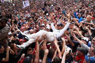 Lewis Hamilton and fans after winning the British GP.