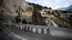 TOPSHOT - Cyclists ride throught the Casse Deserte, to the Col de l&#039;Izoard during the eighteenth stage of the 106th edition of the Tour de France cycling race between Embrun and Valloire, in Valloire, on July 25, 2019. (Photo by Anne-Christine POUJOU