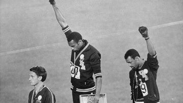 At the 1968 Olympics and during the height of the Civil Rights movement, US 200m runners Tommie Smith (centre) and John Carlos (right) raised their black-gloved fists during the playing of the US national anthem. Silver medallist Peter Norman sported a hu