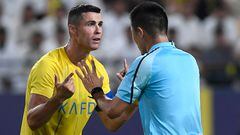 Nassr's Portuguese forward #07 Cristiano Ronaldo argues with the referee during the AFC Champions League playoff football match between Saudi's Al-Nassr and UAE's Shabab Al-Ahli at the King Saud University Stadium in Riyadh on August 22, 2023. (Photo by Yazid al-Duwihi / AFP)