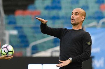 Manchester City's Spanish head coach Pep Guardiola reacts during the friendly football match between Arsenal and Manchester City