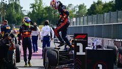 First placed Red Bull Racing's Dutch driver Max Verstappen (C) gets out of his car next to second-placed Red Bull Racing's Mexican driver Sergio Perez (L) after the the Italian Formula One Grand Prix race at Autodromo Nazionale Monza circuit, in Monza on September 3, 2023. Max Verstappen won a record-breaking 10th straight Formula One race on September 3, 2023, after coming out on top at the Italian Grand Prix in a Red Bull one-two at Monza. (Photo by Ben Stansall / AFP)