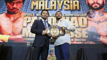 Philippine senator and boxing icon Manny &quot;Pacman&quot; Pacquiao (L) poses for a picture with welterweight world title holder Lucas Matthysse, for their upcoming WBA &quot;regular&quot; welterweight title fight in Kuala Lumpur, Malaysia, during a news