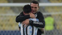 (FILES) In this file photo taken on July 10, 2021 Argentina&#039;s Lionel Messi (L) and coach Lionel Scaloni embrace after winning the Conmebol 2021 Copa America football tournament final match against Brazil at Maracana Stadium in Rio de Janeiro, Brazil. - Argentina&#039;s captain and goal scorer, Lionel Messi, will leave behind for 10 days the European whirlwind of farewells, passes and debuts to get fully into the rocky South American road leading to the Qatar-2022 World Cup, the only trophy he has yet to celebrate. (Photo by NELSON ALMEIDA / AFP)