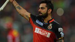 Royal Challengers Bangalore captain and batsman Virat Kohli gestures to the cheering crowd as he walks back to the pavilion after being dismissed for 113 runs during the 2016 Indian Premier League (IPL) Twenty20 cricket match between Royal Challengers Ban