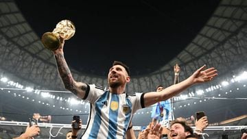 LUSAIL CITY, QATAR - DECEMBER 18: Lionel Messi of Argentina celebrates with the FIFA World Cup Qatar 2022 Winner's Trophy after the team's victory during the FIFA World Cup Qatar 2022 Final match between Argentina and France at Lusail Stadium on December 18, 2022 in Lusail City, Qatar. (Photo by Shaun Botterill - FIFA/FIFA via Getty Images)