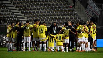 Colombian players pray at the end Argentina 2023 U-20 World Cup Group C football match between Japon and Colombia at the Diego Armando Maradona stadium in La Plata, Argentina, on May 24, 2023. (Photo by LUIS ROBAYO / AFP)