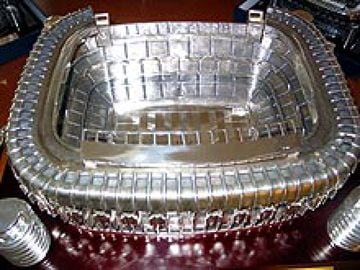 In 2002, Real Madrid celebrated their 100th anniversary and a special trophy was produced for the tournament. A replica of the Santiago Bernabéu stadium in silver on a wooden base.