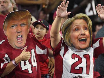 GLENDALE, AZ - OCTOBER 17:  Arizona Cardinals fans wear masks of Presidential candidates Donald Trump and Hillary Clinton during the NFL game between the New York Jets and Arizona Cardinals at University of Phoenix Stadium on October 17, 2016 in Glendale,