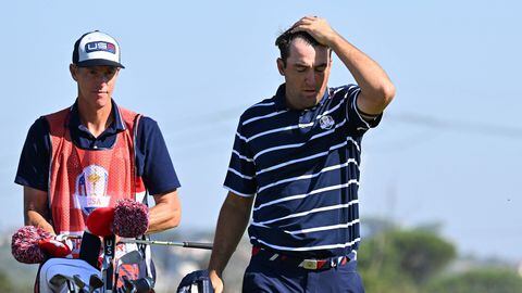 US golfer, Scottie Scheffler (R) reacts on the 15th green during his foursomes match on the first day of play in the 44th Ryder Cup at the Marco Simone Golf and Country Club in Rome on September 29, 2023. (Photo by Andreas SOLARO / AFP)