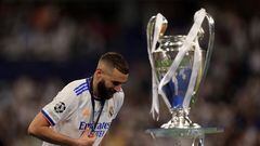 FILE PHOTO: Soccer Football - Champions League Final - Liverpool v Real Madrid - Stade de France, Saint-Denis near Paris, France - May 28, 2022 Real Madrid's Karim Benzema celebrates with his medal as he walks past the trophy after winning the Champions League REUTERS/Lee Smith/File Photo
