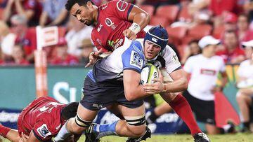 Waita Setu of the Queensland Reds tackles Ross Haylett-Petty of the Western Force during the Super Rugby match at Suncorp Stadium in Brisbane, Australia.