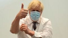 Britain&#039;s Prime Minister Boris Johnson gives a thumbs up after receiving his second jab of the Oxford/AstraZeneca Covid-19 vaccine  at the Francis Crick Institute in central London on June 3, 2021. (Photo by Matt Dunham / POOL / AFP)