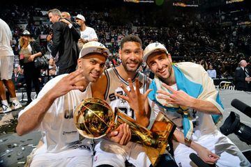 SAN ANTONIO, TX - JUNE 15: Manu Ginobili #20, Tony Parker #9, and Tim Duncan #21 of the San Antonio Spurs celebrate with the Larry O'Brien trophy after defeating the Miami Heat to win the 2014 NBA Finals in Game Five of the 2014 NBA Finals on June 15, 201