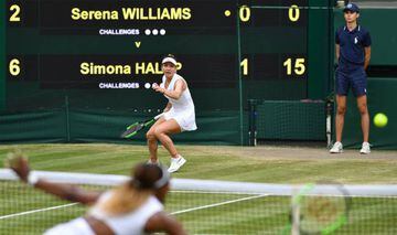 US player Serena Williams (near) returns against Romania's Simona Halep (far) during their women's singles final on day twelve of the 2019 Wimbledon Championships at The All England Lawn Tennis Club in Wimbledon, southwest London, on July 13, 2019