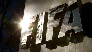FILE PHOTO: The sun is reflected in FIFA's logo in front of FIFA's headquarters in Zurich, Switzerland November 19, 2015. REUTERS/Arnd Wiegmann/File Photo