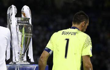 Buffon walks past the Champions League trophy after Juventus' final defeat to Real Madrid in Cardiff this month.