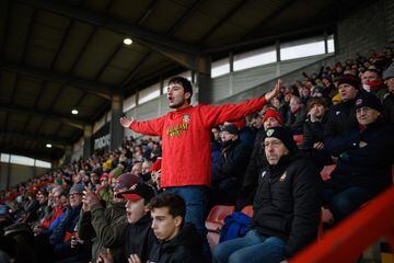 Supporters react as they attend a National League fixture football match between Wrexham Association Football Club 