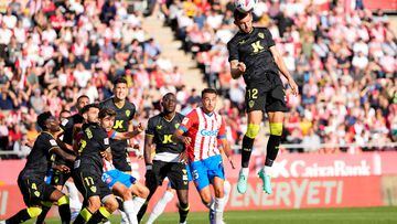 Almeria's Brazilian forward #12 Leo Baptistao heads the ball during the Spanish league football match between Girona FC and UD Almeria at the Montilivi stadium in Girona on October 22, 2023. (Photo by Pau BARRENA / AFP)