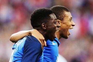 Ousmane Dembele of France celebrates with Kylian Mbappe